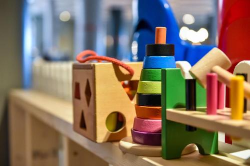 a group of wooden toys sitting on a counter at Scandic Byparken in Bergen