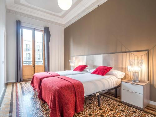 מיטה או מיטות בחדר ב-Rent Top Apartments Rambla Catalunya