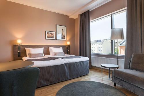 Postel nebo postele na pokoji v ubytování Scandic Vaasa