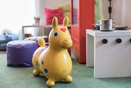 a toy plastic horse toy on the floor in a room at Scandic Oulu Station in Oulu