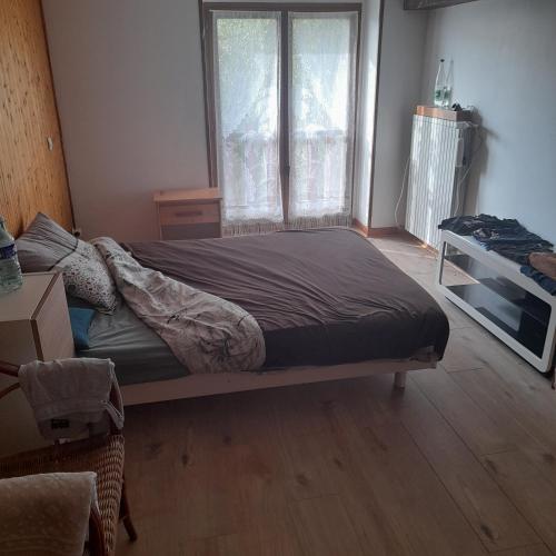 Ένα ή περισσότερα κρεβάτια σε δωμάτιο στο maison JARRIE
