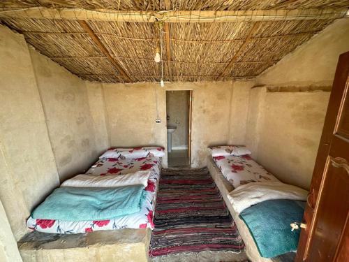 Una cama o camas en una habitación de M Biama Island
