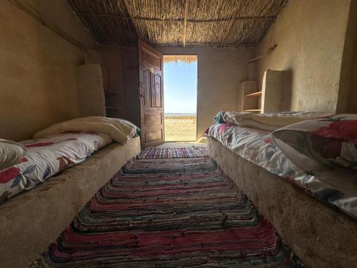 Una cama o camas en una habitación de M Biama Island