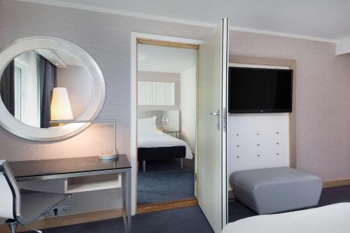 Кровать или кровати в номере Scandic Royal Stavanger
