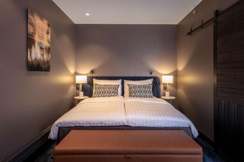 a bedroom with a large bed with two pillows at Scandic Hamburger Börs in Turku