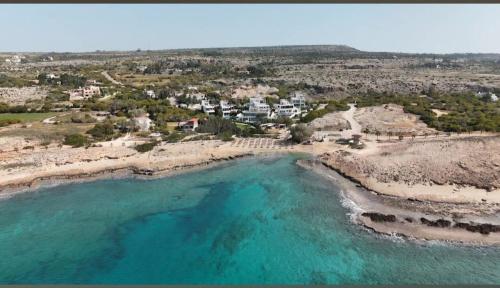 an aerial view of a beach with turquoise water at Seaview Luxury Villa Fortuna in Ayia Napa