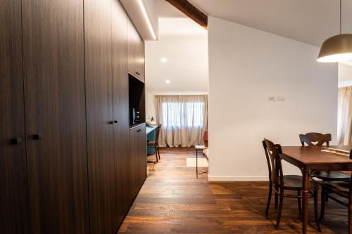 a kitchen and dining room with a table and chairs at Agave in Centrale in Milan