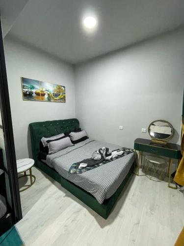 Ένα ή περισσότερα κρεβάτια σε δωμάτιο στο MLH Designer Suites @ Jesselton Quay CityPads