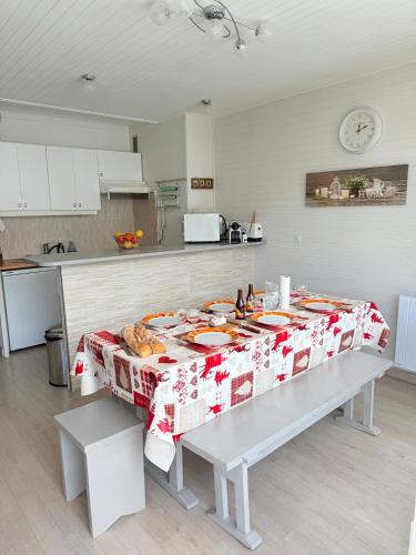 a kitchen with a table with food on it at Apt Ideal Famille Pied des pistes - 46m2 - 6 pers in Vars