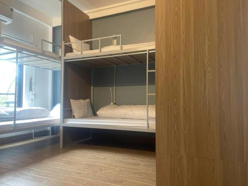 a bedroom with bunk beds in a room at Tamcoc Backpackers Hostel Homestay in Ninh Binh