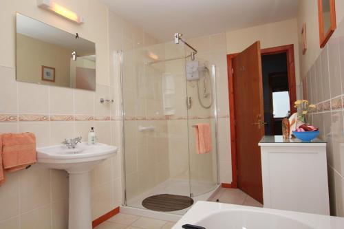 a bathroom with a shower and a sink at Shiant View in Lochs