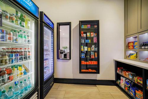 a store with a refrigerator filled with lots of food at Homewood Suites by Hilton Plano-Richardson in Plano