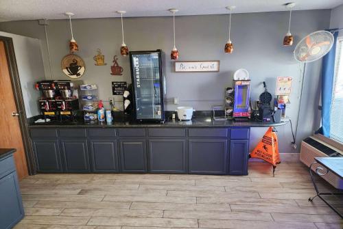 a counter in a coffee shop with a counter top at Super 8 by Wyndham Galesburg in Galesburg