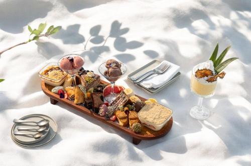 a tray of food on a table with a drink at Stayso The House Hotel in Istanbul