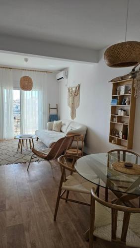 a living room with a bed and chairs and a table at Monte View Apartments in Ulcinj