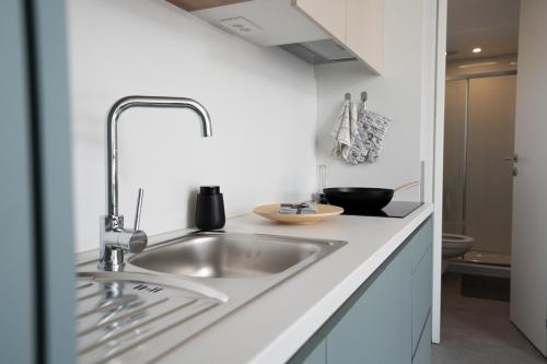 a kitchen with a sink and a counter top at Mobile home Maslina Sveti Petar na Moru in Sveti Petar