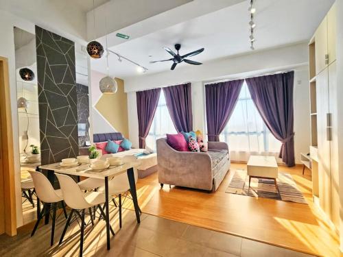 a living room with a couch and a table at Grand Horizon Imperium Residence Kuantan Studio City view in Kuantan