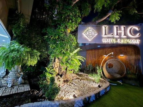 a large tree in front of a hotel room at LHC HOTEL AND RESORT in Pattaya Central