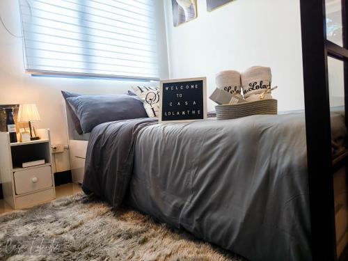Ένα ή περισσότερα κρεβάτια σε δωμάτιο στο Casa Lolanthe Fully Furnished Studio Unit