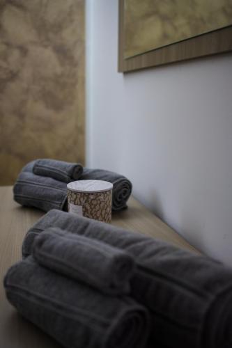 a wooden table with three blue blankets on it at Villa Margares in Valenzano