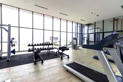 a gym with treadmills and exercise equipment in a building at Imperio Residence Melaka in Melaka