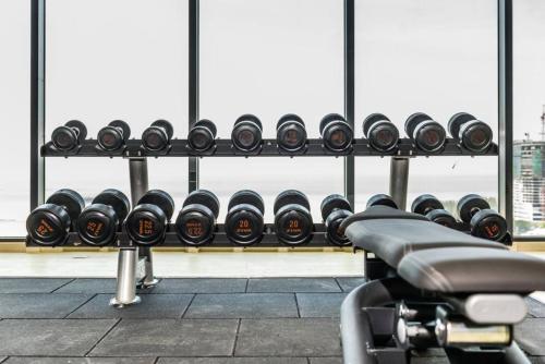 a row of dumbbells in a gym at Imperio Residence Melaka in Melaka