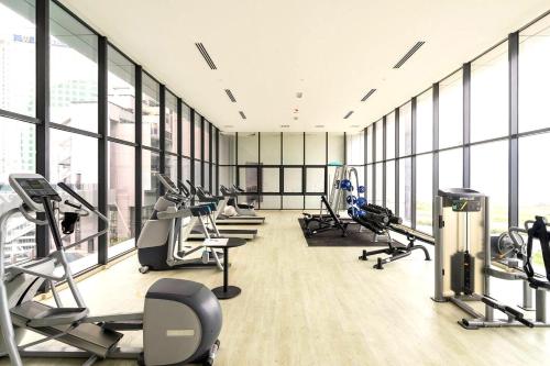 a gym with treadmills and elliptical machines at Imperio Residence Melaka in Melaka