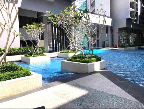 a swimming pool in the middle of a building at Imperio Residence Melaka in Melaka