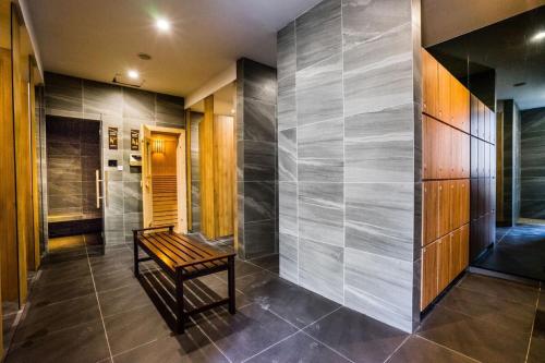 a hallway with a bench in a house at Imperio Residence Melaka in Melaka