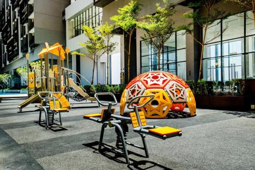 a playground in a building with playground equipment at Imperio Residence Melaka in Melaka