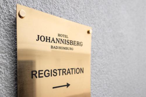 a sign on a wall that reads bad departure at Hotel Johannisberg Bad Homburg in Bad Homburg vor der Höhe