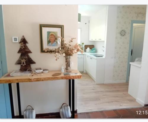 a kitchen with a table with a christmas tree on it at Increible casa de campo, 5 DORM, MARCO INCOMPARABLE in Pareja