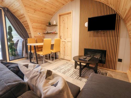 a living room with a couch and a table at Lapwing in Carnforth