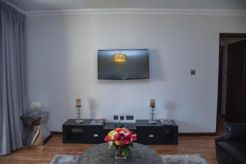 TV a/nebo společenská místnost v ubytování Lavington Residences By Trianum