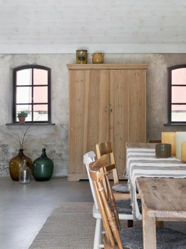 a dining room with a table and two chairs at Unique house outside Borås in Fritsla