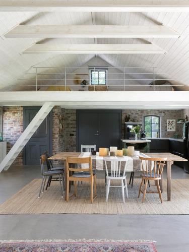 a dining room with a table and chairs at Unique house outside Borås in Fritsla