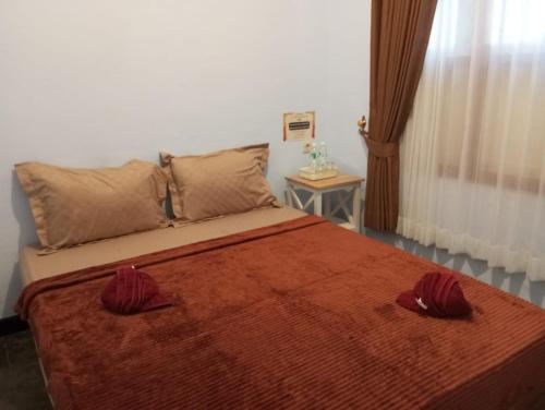 Katil atau katil-katil dalam bilik di Ijen & Sleep Homestay