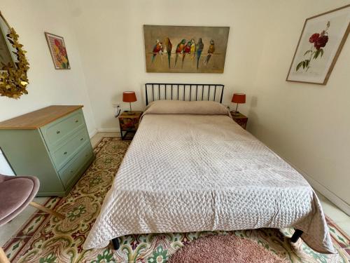 a bedroom with a bed and a dresser at Stylish Boutique Duplex Apartment Home - Green - 2 Large Double Bedrooms with Ensuite Bathrooms in Msida