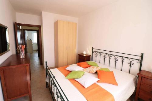 a bedroom with a bed with pillows on it at Casa Martina in Otranto in Otranto
