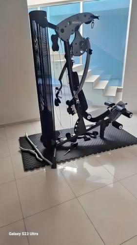 a exercise bike sitting on a floor in a room at Beachfront Luxury Villa Glory in Ayia Napa
