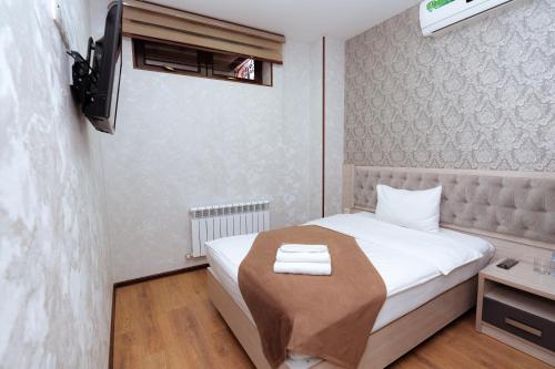 Кровать или кровати в номере Diamond Hotel Tashkent