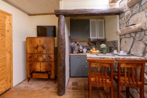 a kitchen with a table and a counter top at Villa Rosa di Nonna Rosa in Vico Equense