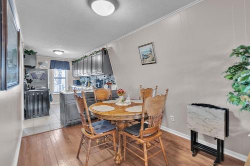 a kitchen and dining room with a table and chairs at Beautiful Lakeview Chateau with Stunning Views home in Rutledge