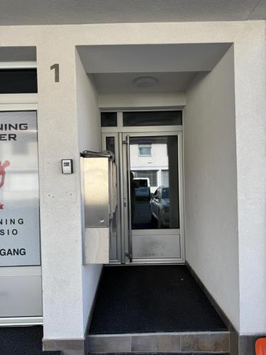 an entrance to a building with a sliding glass door at Ferienoase Granula - Bad Ragaz in Bad Ragaz