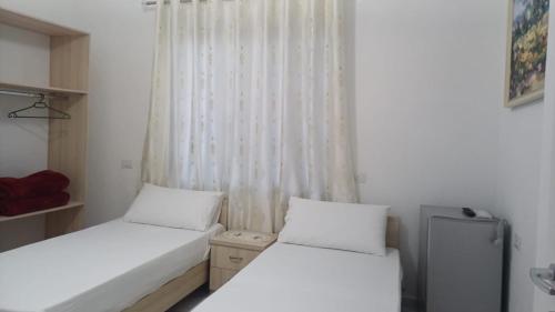 Postel nebo postele na pokoji v ubytování Hotel Sherifaj