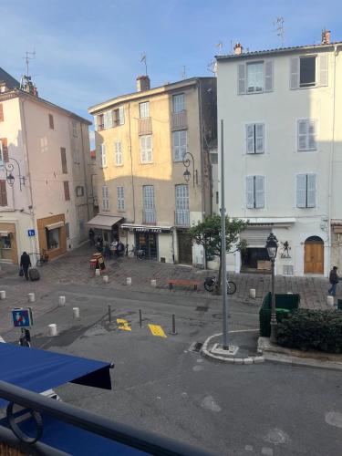 a view of a street with two buildings at 2 rooms, old town in Antibes