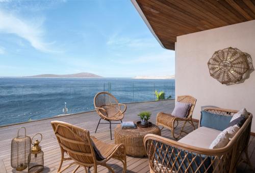 a living room with a view of the ocean at Swissôtel Living Bodrum in Bodrum City