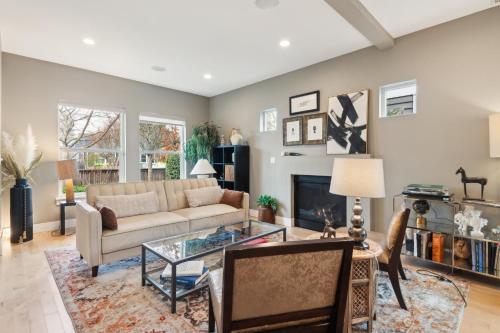 a living room with a couch and a table at Spacious Family Retreat - Media Room & Patio home in Seattle
