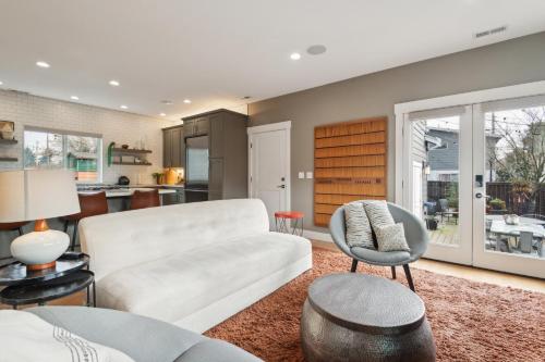 a living room with a couch and a chair at Spacious Family Retreat - Media Room & Patio home in Seattle