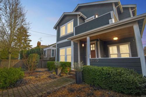 a house with a blue house at Spacious Family Retreat - Media Room & Patio home in Seattle